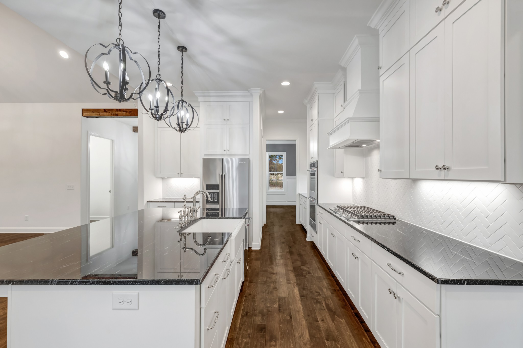 7483 Liberty Road Fairview, TN 37062 - Photo 26 of 65 a kitchen with stainless steel appliances granite countertop a sink a stove and a refrigerator