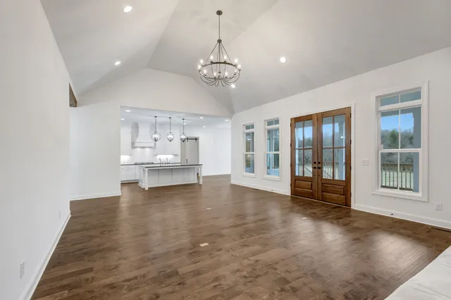 a bathroom with a sink toilet a mirror and shower