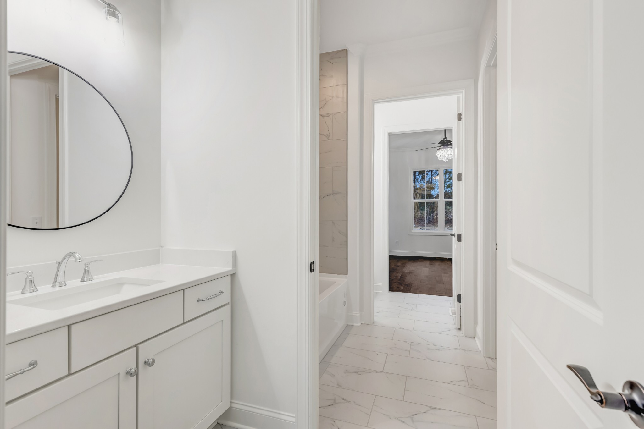 7483 Liberty Road Fairview, TN 37062 - Photo 38 of 65 a en suite bathroom with a sink and a mirror