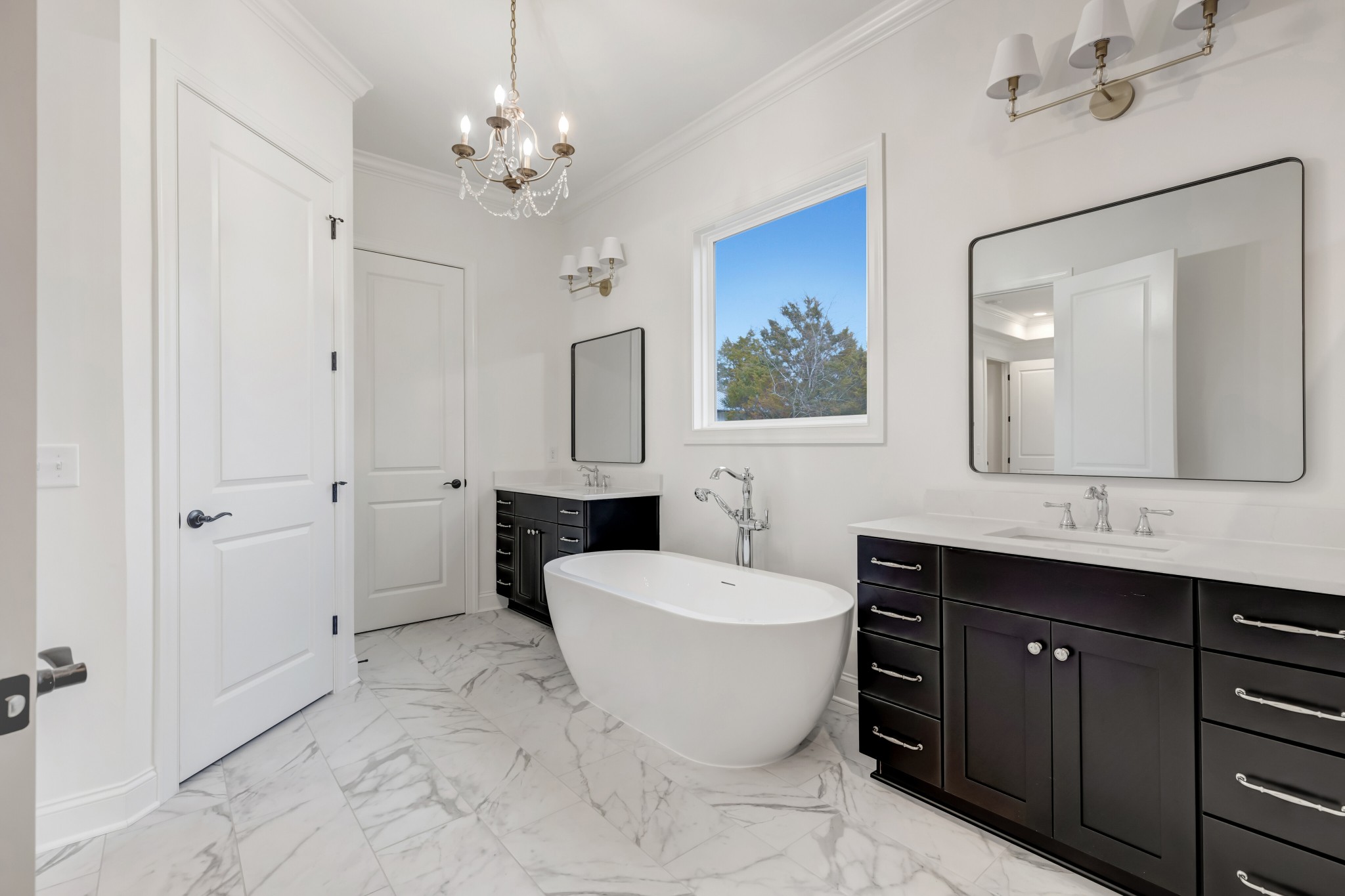 7483 Liberty Road Fairview, TN 37062 - Photo 43 of 65 a spacious bathroom with a toilet sink and mirror