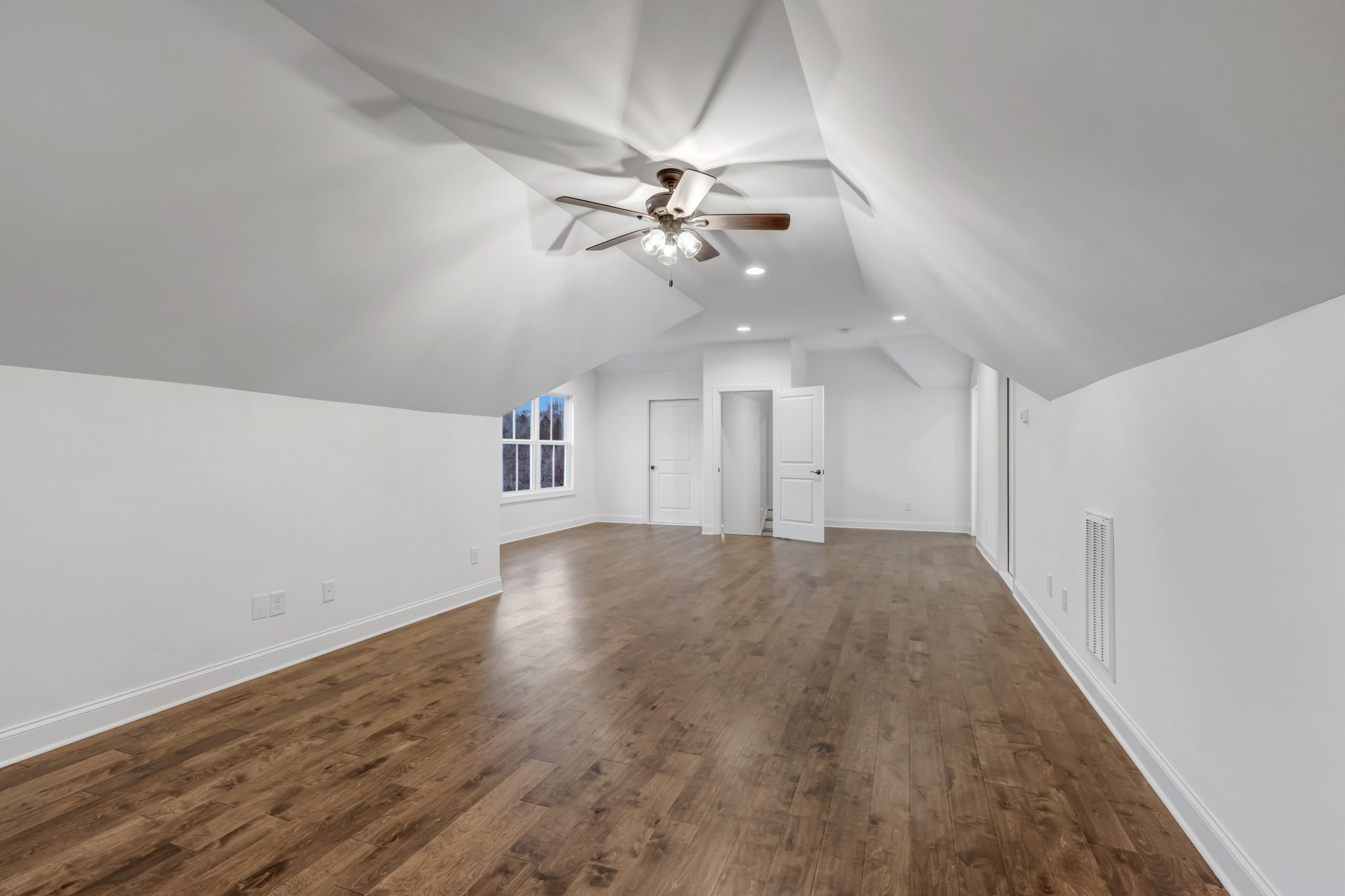 7483 Liberty Road Fairview, TN 37062 - Photo 47 of 65 an empty room with chandelier fan and windows