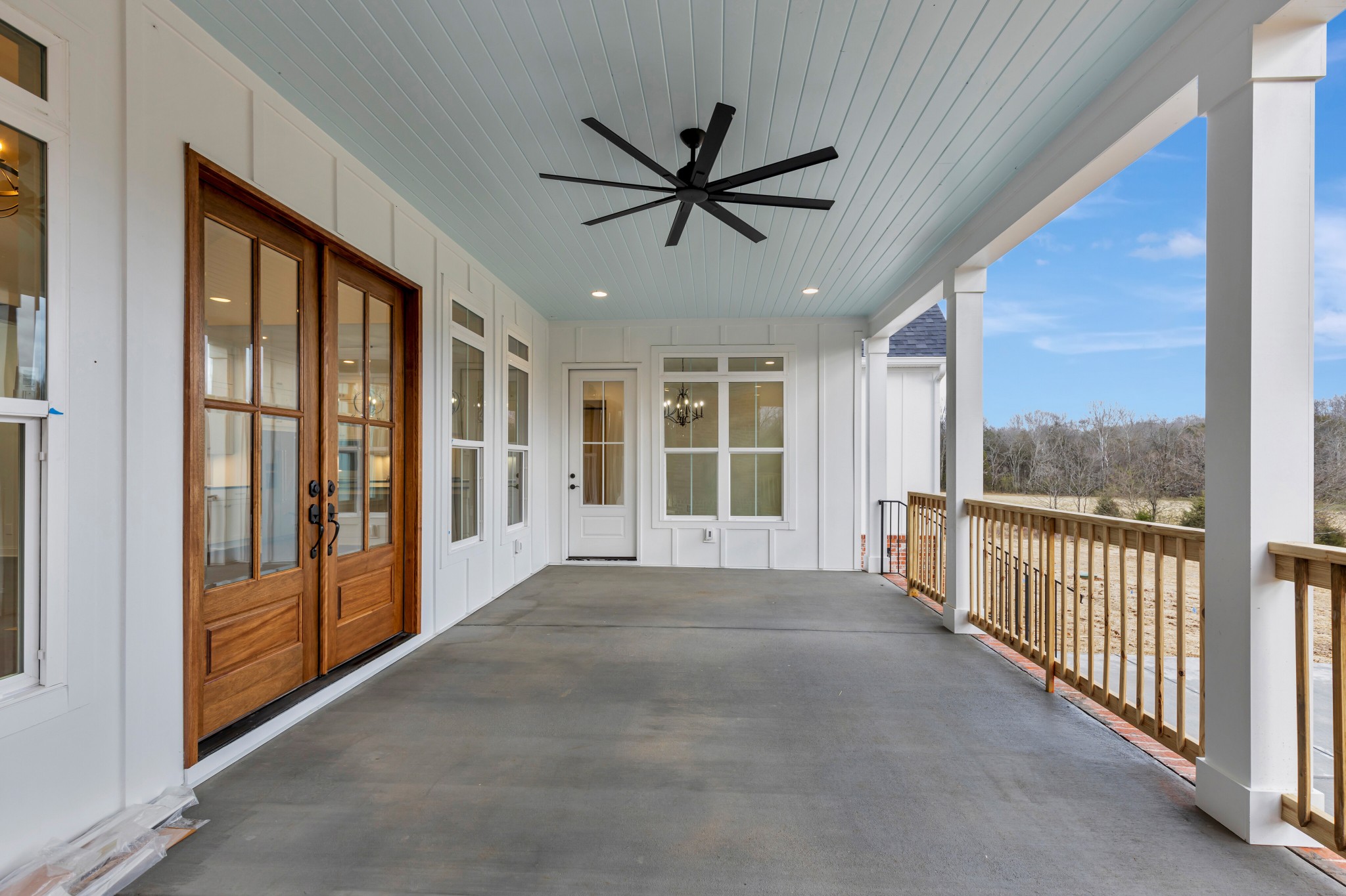 7483 Liberty Road Fairview, TN 37062 - Photo 51 of 65 a view of a livingroom with a ceiling fan and windows