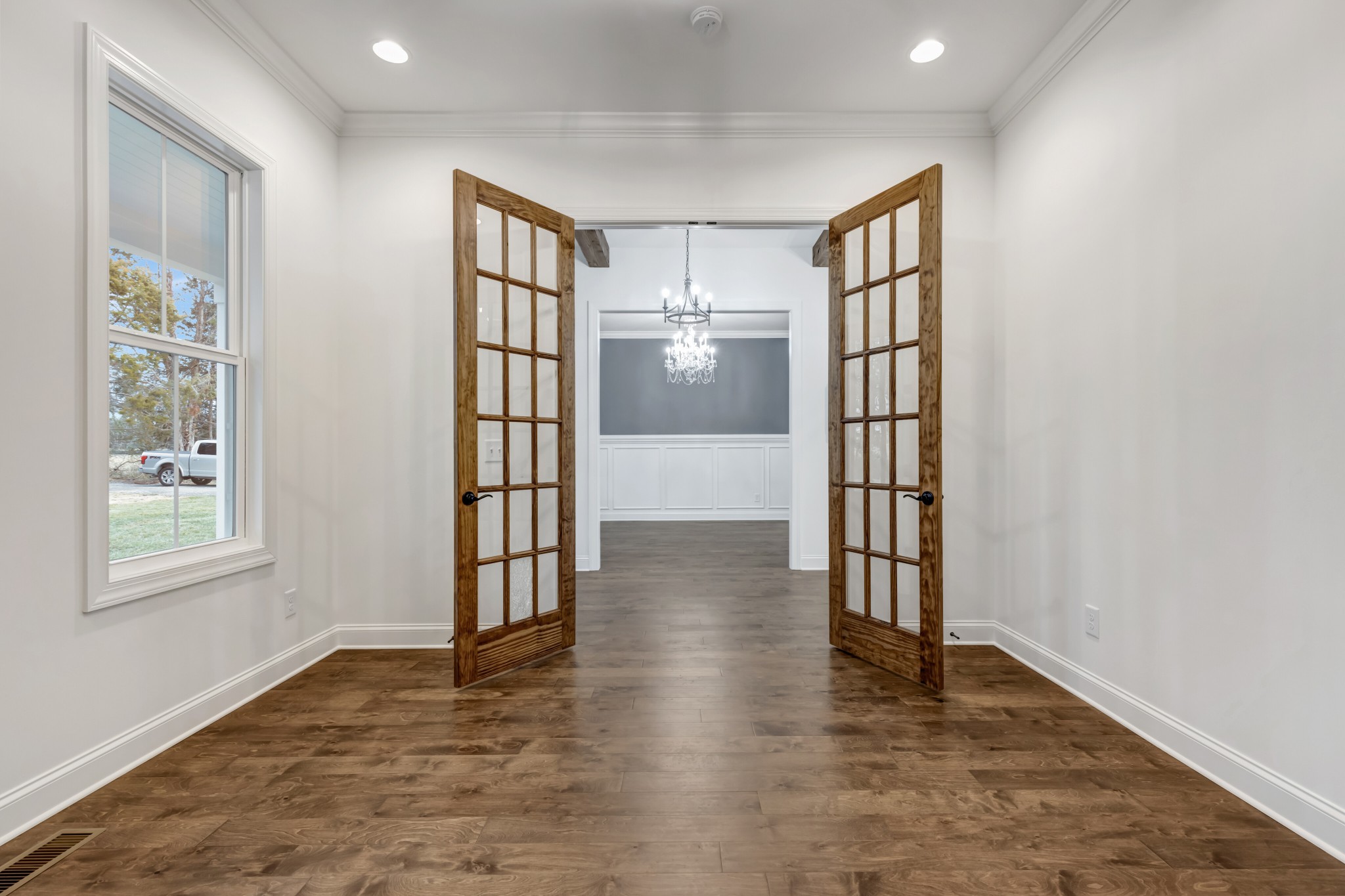 7483 Liberty Road Fairview, TN 37062 - Photo 9 of 65 an empty room with wooden floor and windows
