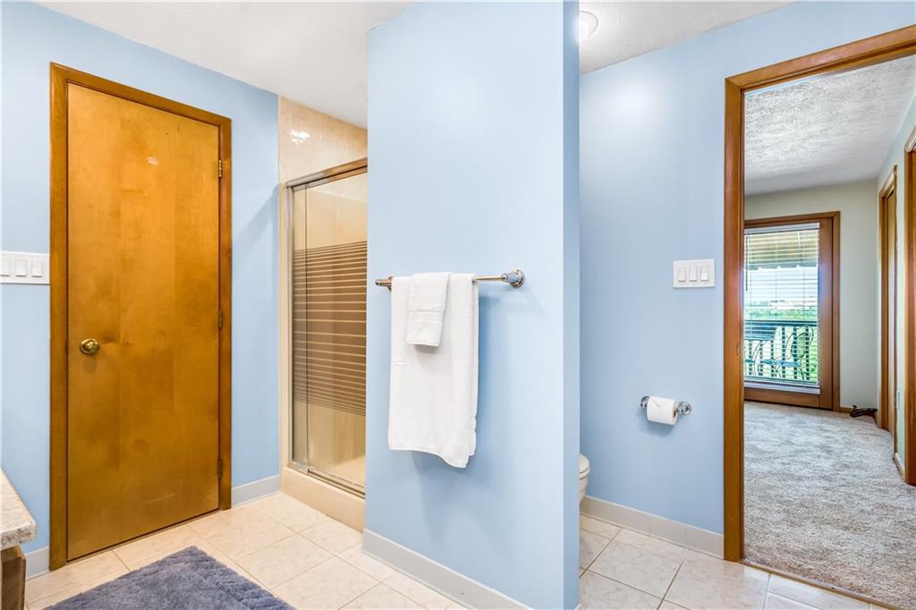 129 MacArthur Road Clairton, PA 15025 - Photo 15 of 25 Large Main Bathroom Features a Jet Spray Tub, Separate Shower and Vanity with Corian Counter Top and Double Sinks!