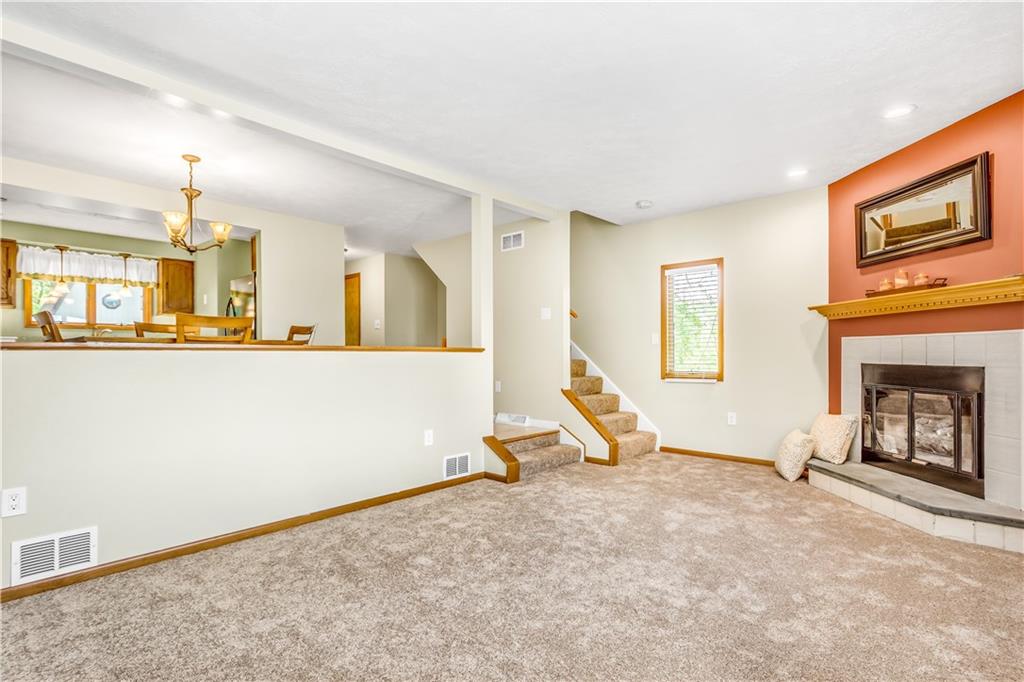 129 MacArthur Road Clairton, PA 15025 - Photo 4 of 25 Living Room with is Graced with Lots of Natural Light and Includes a Corner Gas Fireplace.