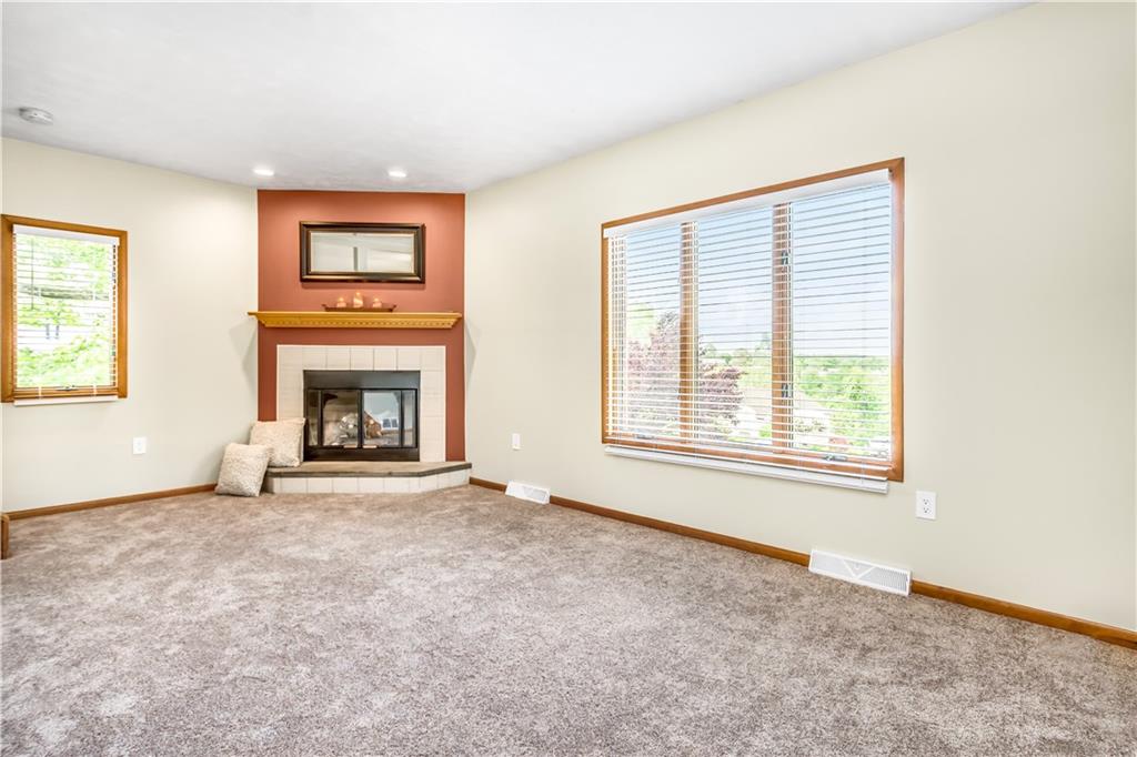 129 MacArthur Road Clairton, PA 15025 - Photo 5 of 25 Living Room with is Graced with Lots of Natural Light and Includes a Corner Gas Fireplace.