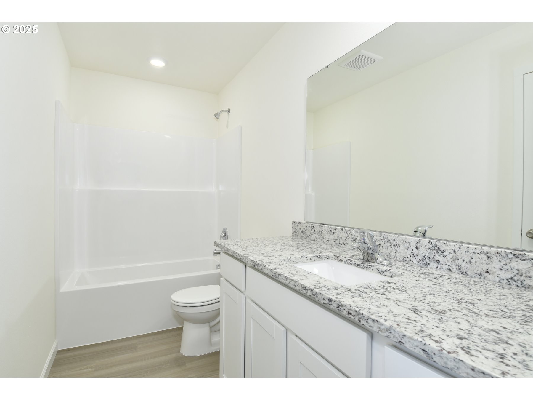 3933 Southwest Duniway Lane Gresham, OR 97080 - Photo 19 of 24 a bathroom with a granite countertop sink a toilet and shower