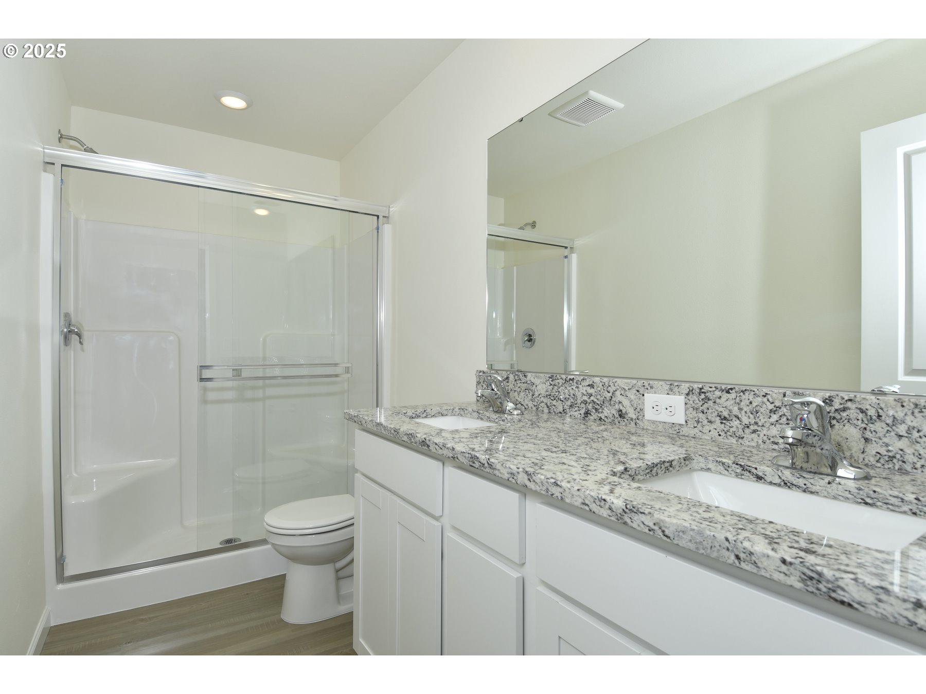 3933 Southwest Duniway Lane Gresham, OR 97080 - Photo 23 of 24 a bathroom with a granite countertop sink a toilet and shower