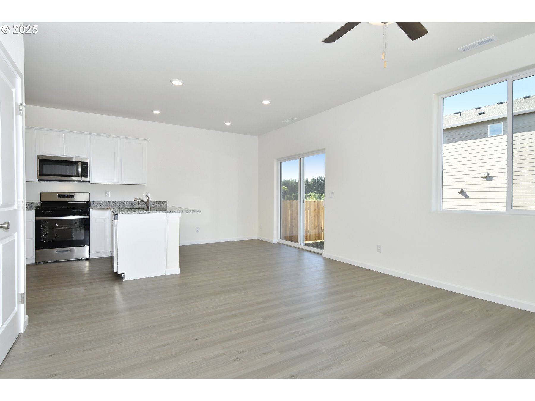 3933 Southwest Duniway Lane Gresham, OR 97080 - Photo 4 of 24 a view of kitchen with sink microwave and stove