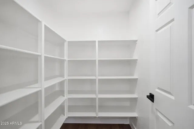a bathroom with a granite countertop sink toilet a mirror and shower