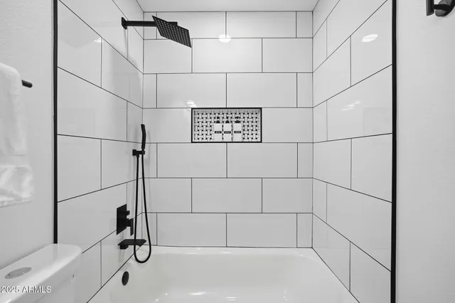 a view of an empty room with a staircase