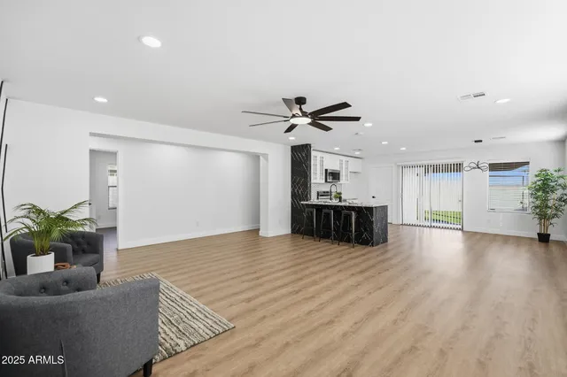 a view of a livingroom with furniture and window
