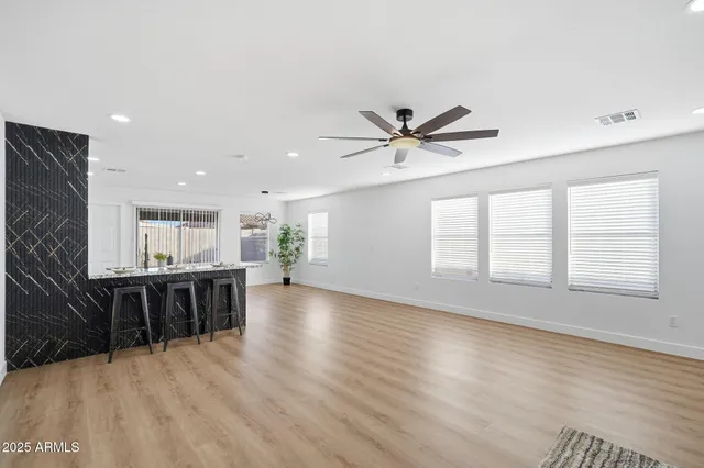 a view of kitchen with sink microwave and refrigerator