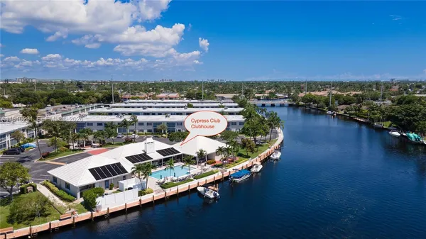 an aerial view of a house with a ocean view