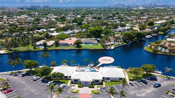 an aerial view of a house with a swimming pool yard and outdoor seating