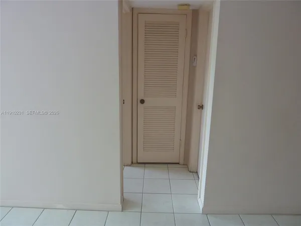 a bathroom with a granite countertop toilet and a shower