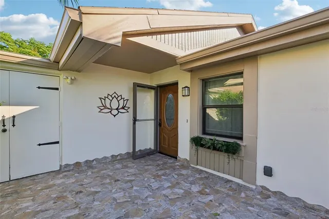 an aerial view of a house with a lake view