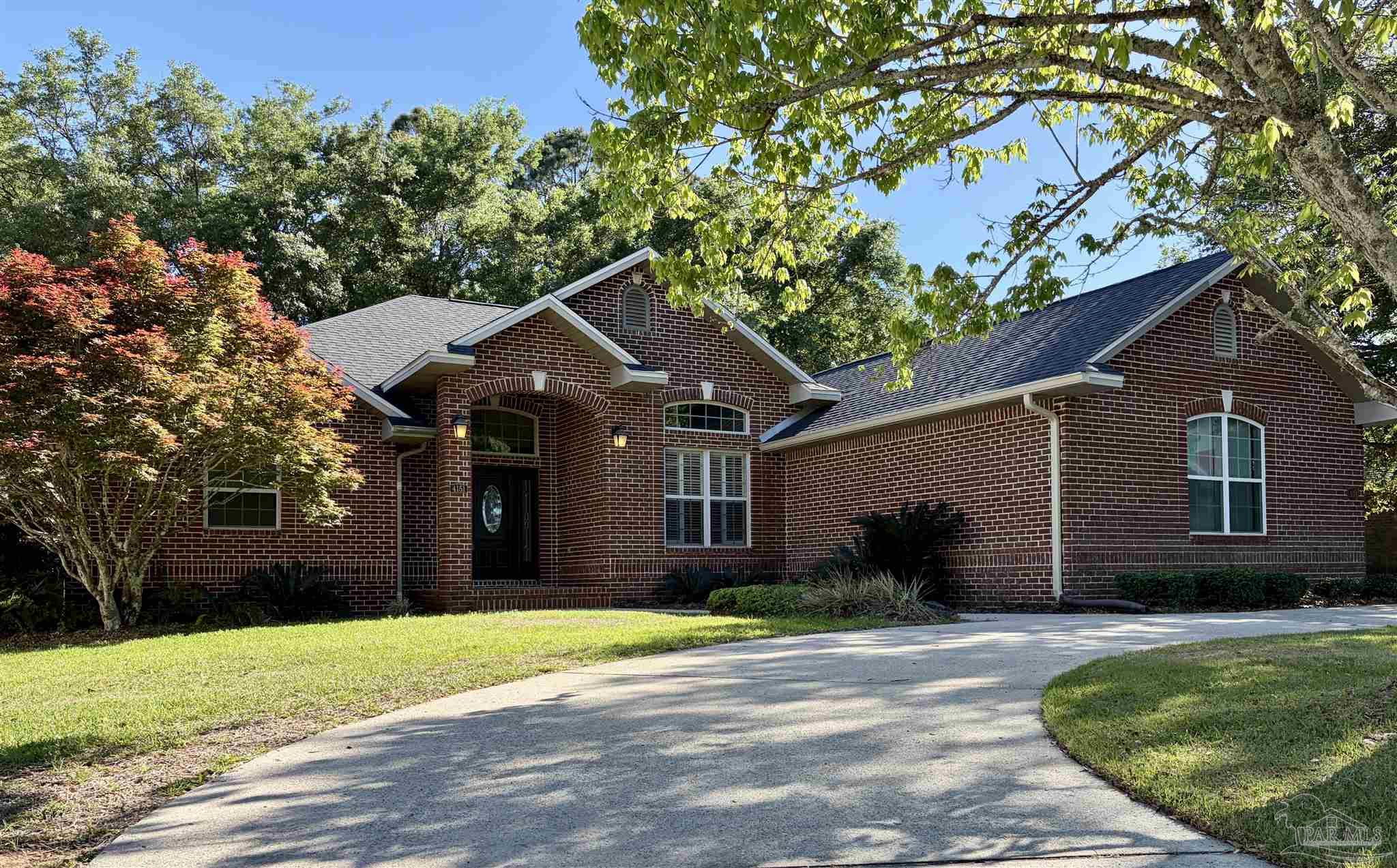 4151 Castle Gate Drive Pace, FL 32571 - Photo 1 of 17 Brick exterior with the circular drive