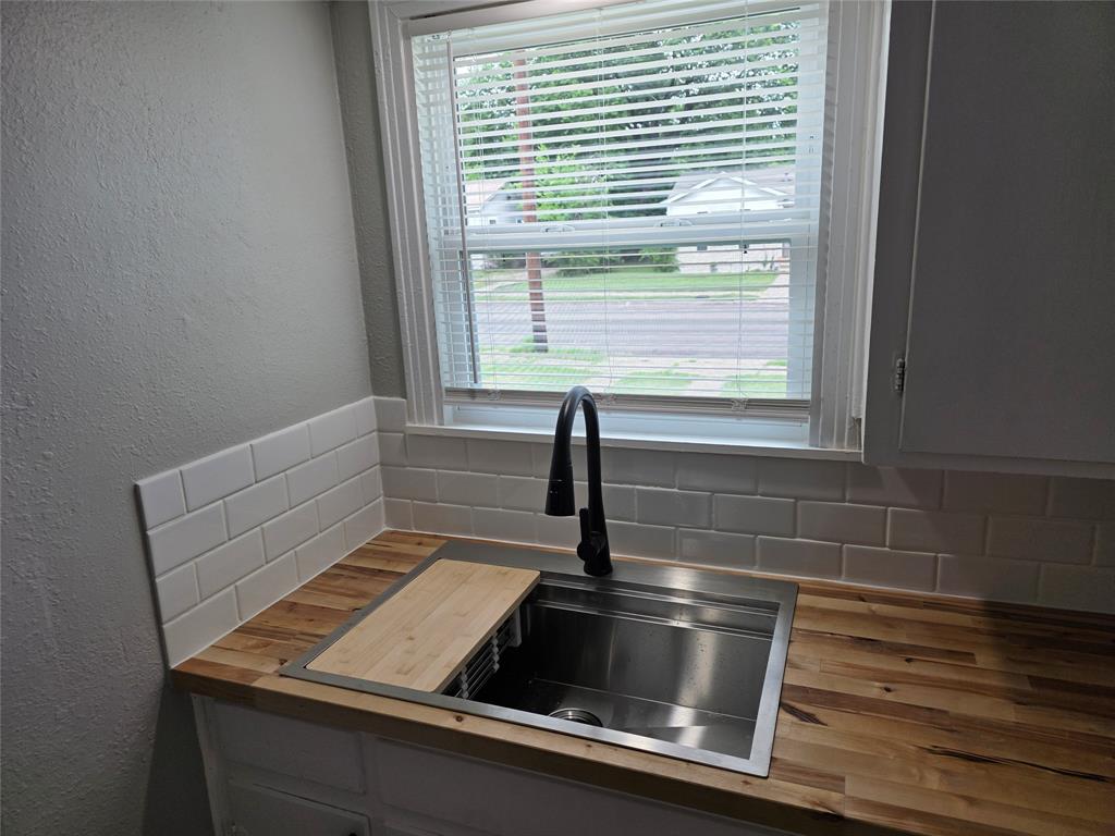 2804 Summer Avenue Waco, TX 76708 - Photo 11 of 13 Stainless steel undermount sink with a matte black gooseneck faucet