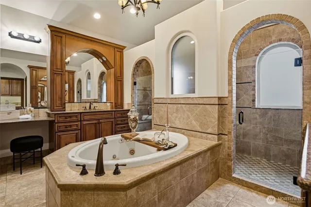 a bath tub sitting next to a bathroom sink
