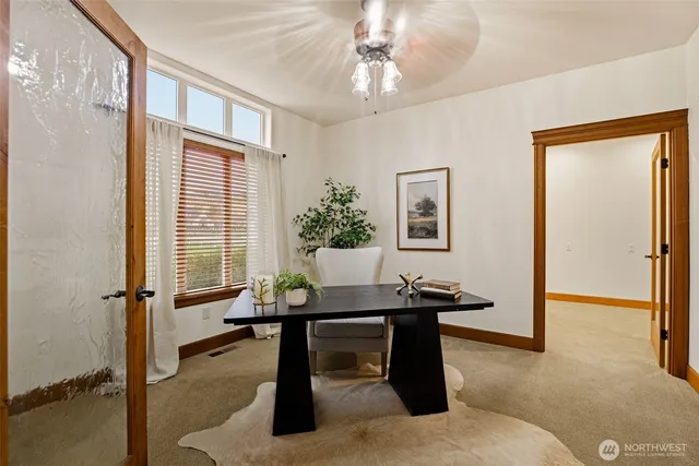 a view of a livingroom with furniture and window