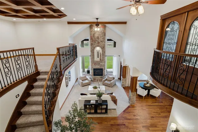 a view of hall way with furniture and staircase