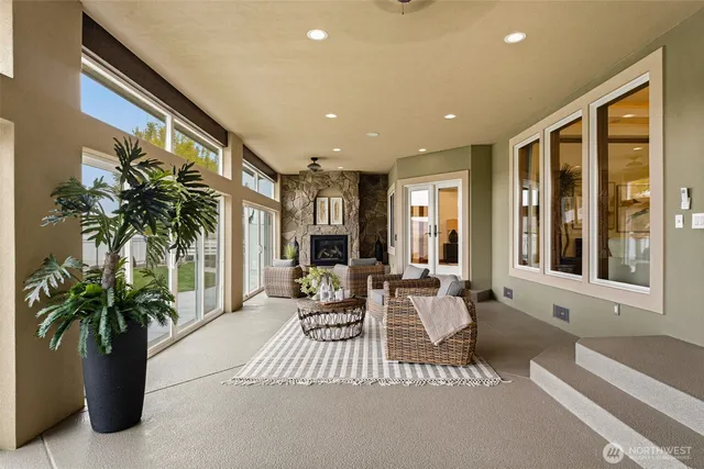 a living room with furniture and a potted plant