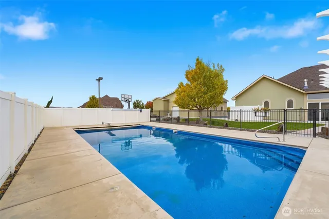 a view of swimming pool with lounge chair