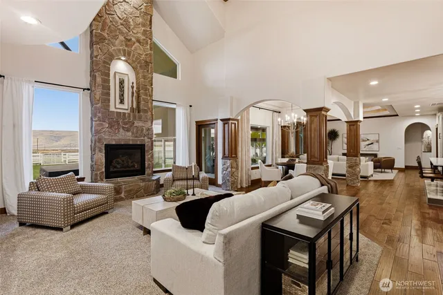 a living room with fireplace furniture and a fireplace