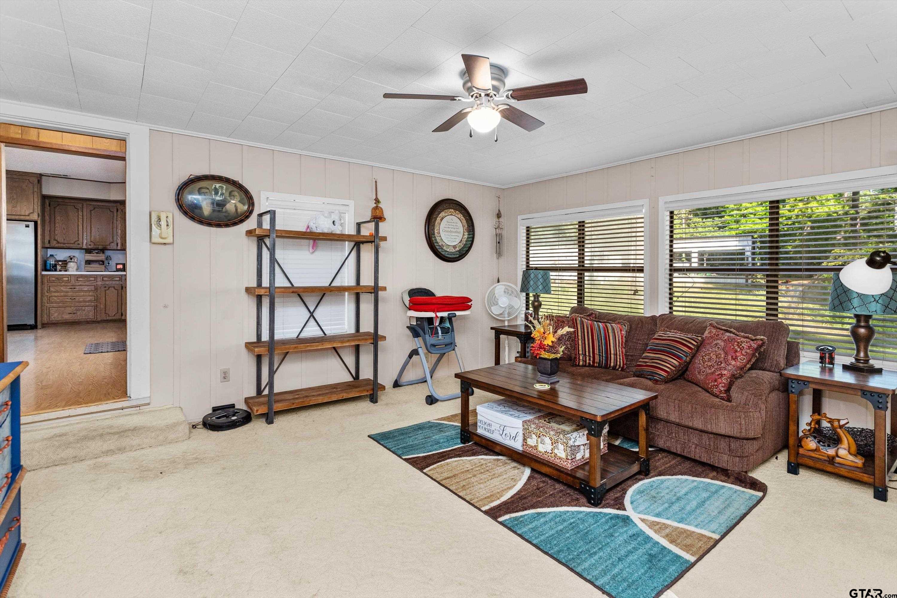 552 Highway 7 Crockett, TX 75835 - Photo 12 of 35 a living room with furniture a window and a clock