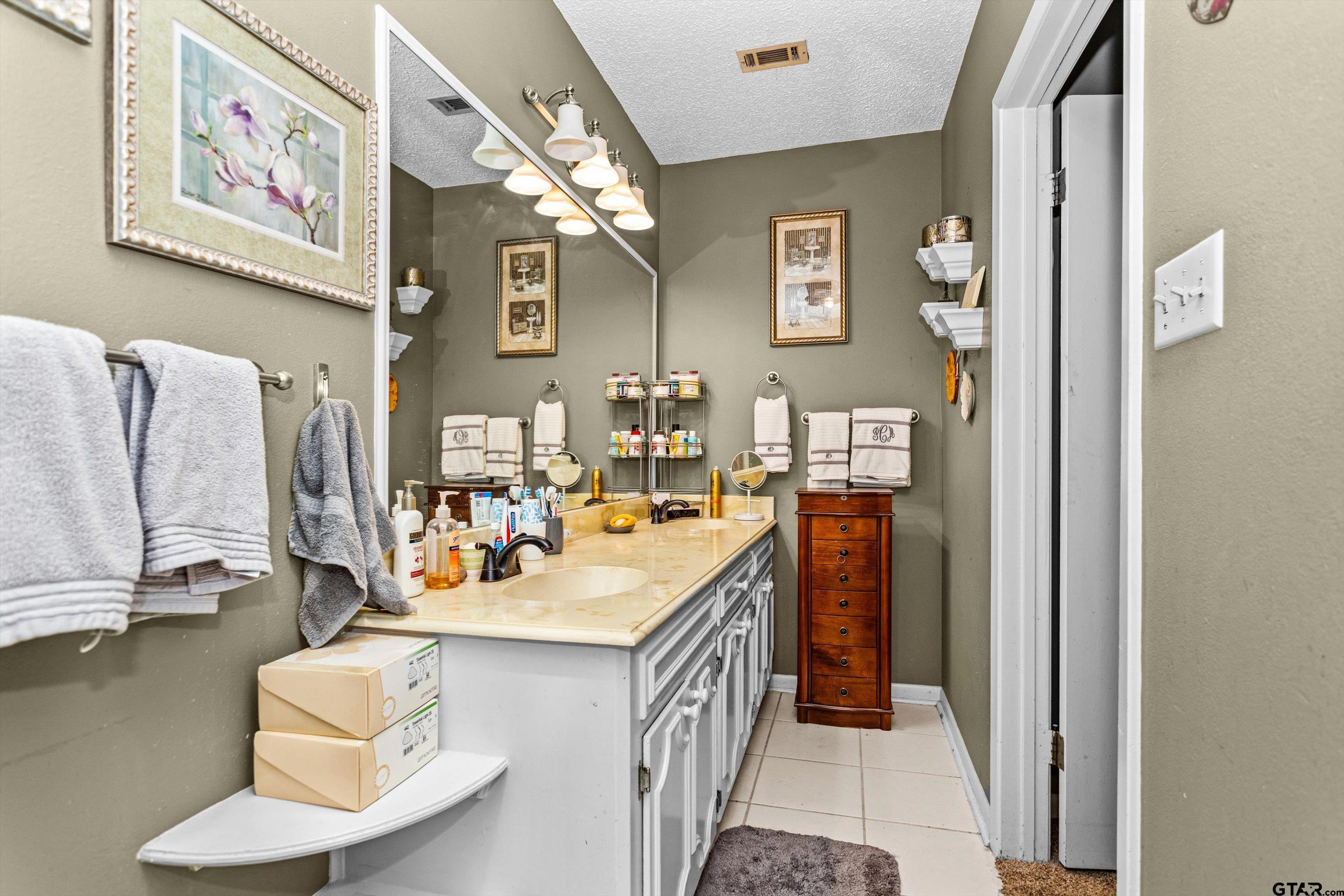 552 Highway 7 Crockett, TX 75835 - Photo 15 of 35 a bathroom with a sink double vanity and a mirror