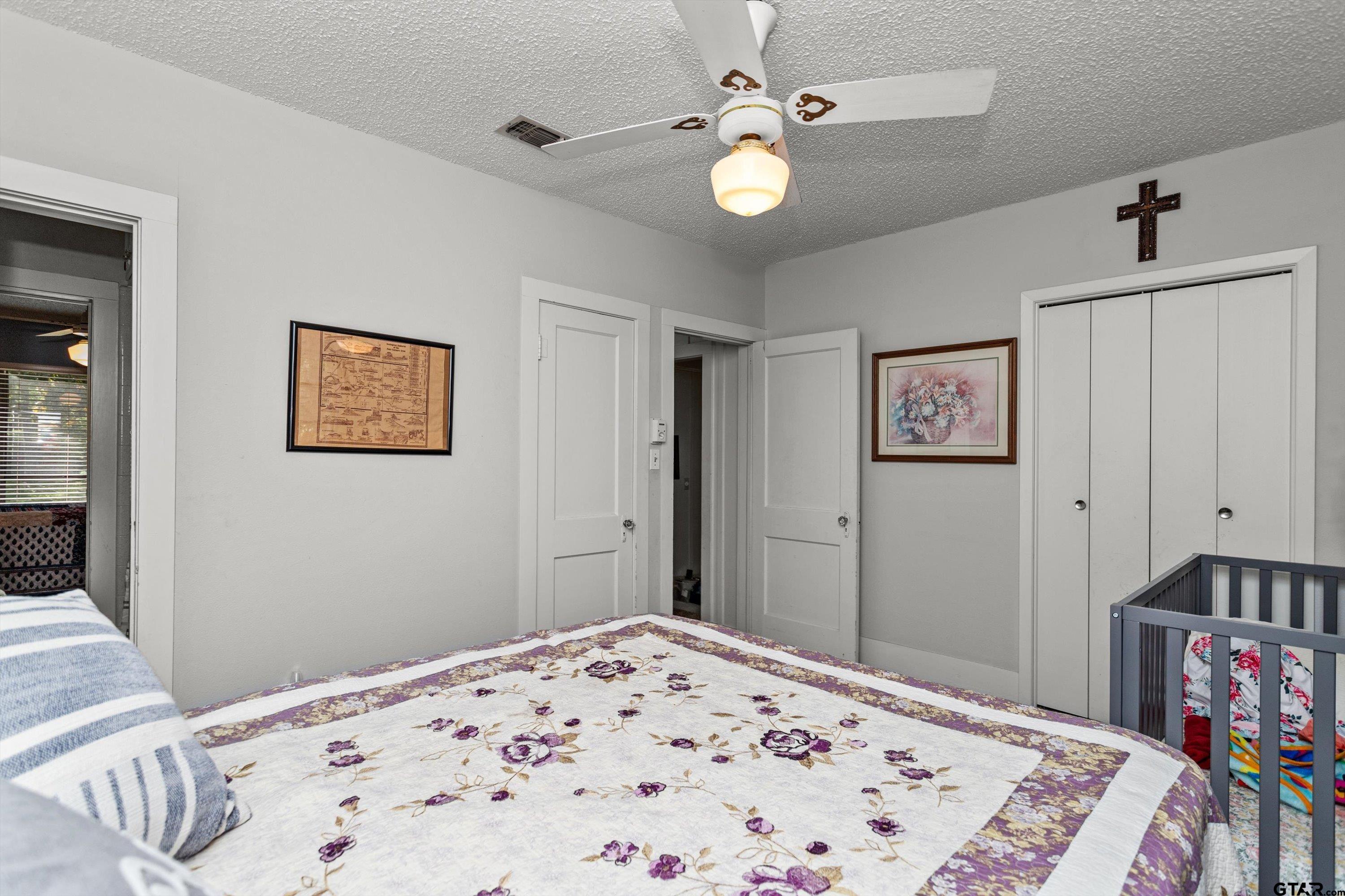 552 Highway 7 Crockett, TX 75835 - Photo 18 of 35 a bedroom with a bed and a dresser