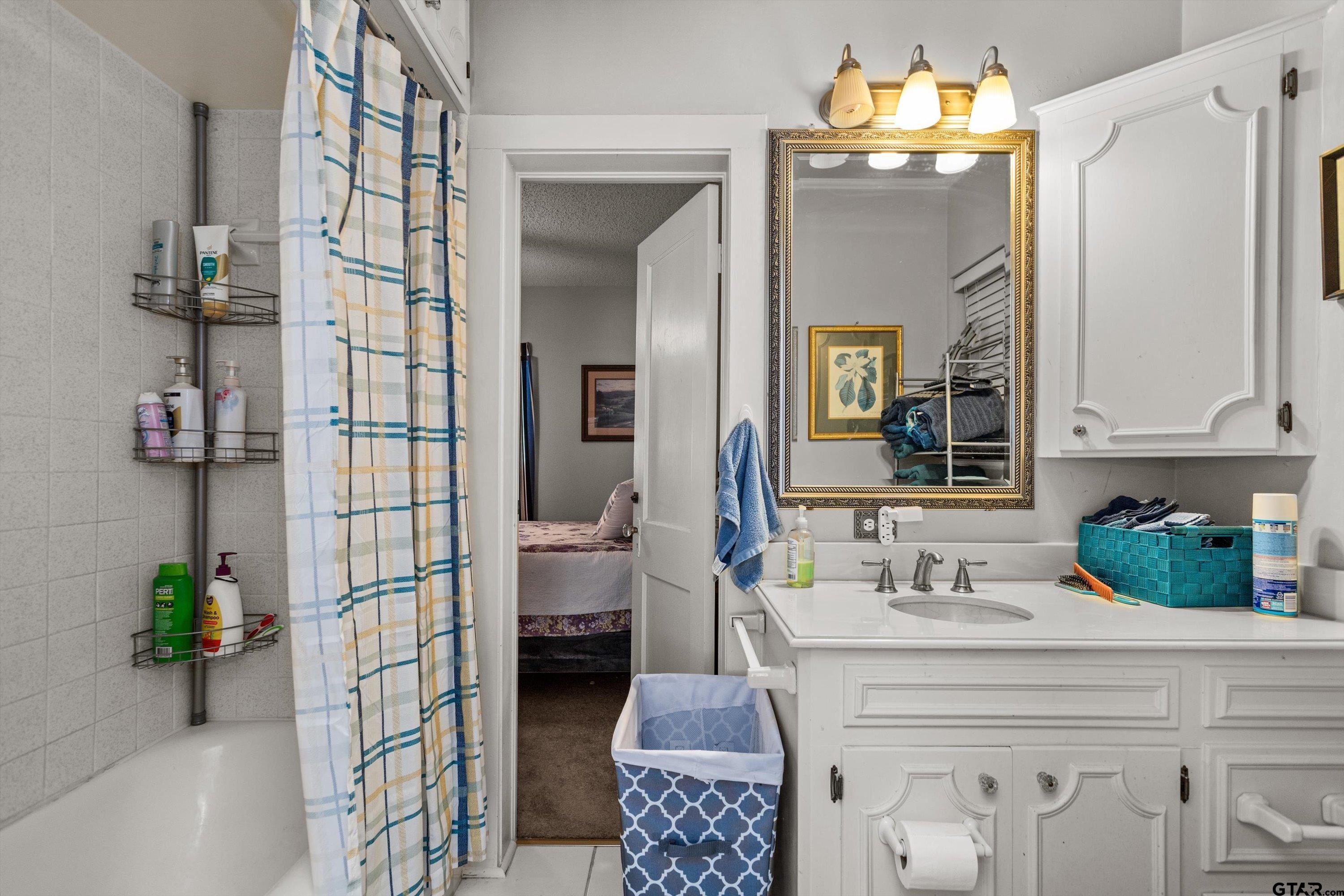 552 Highway 7 Crockett, TX 75835 - Photo 19 of 35 a spacious bathroom with a double vanity sink and a mirror