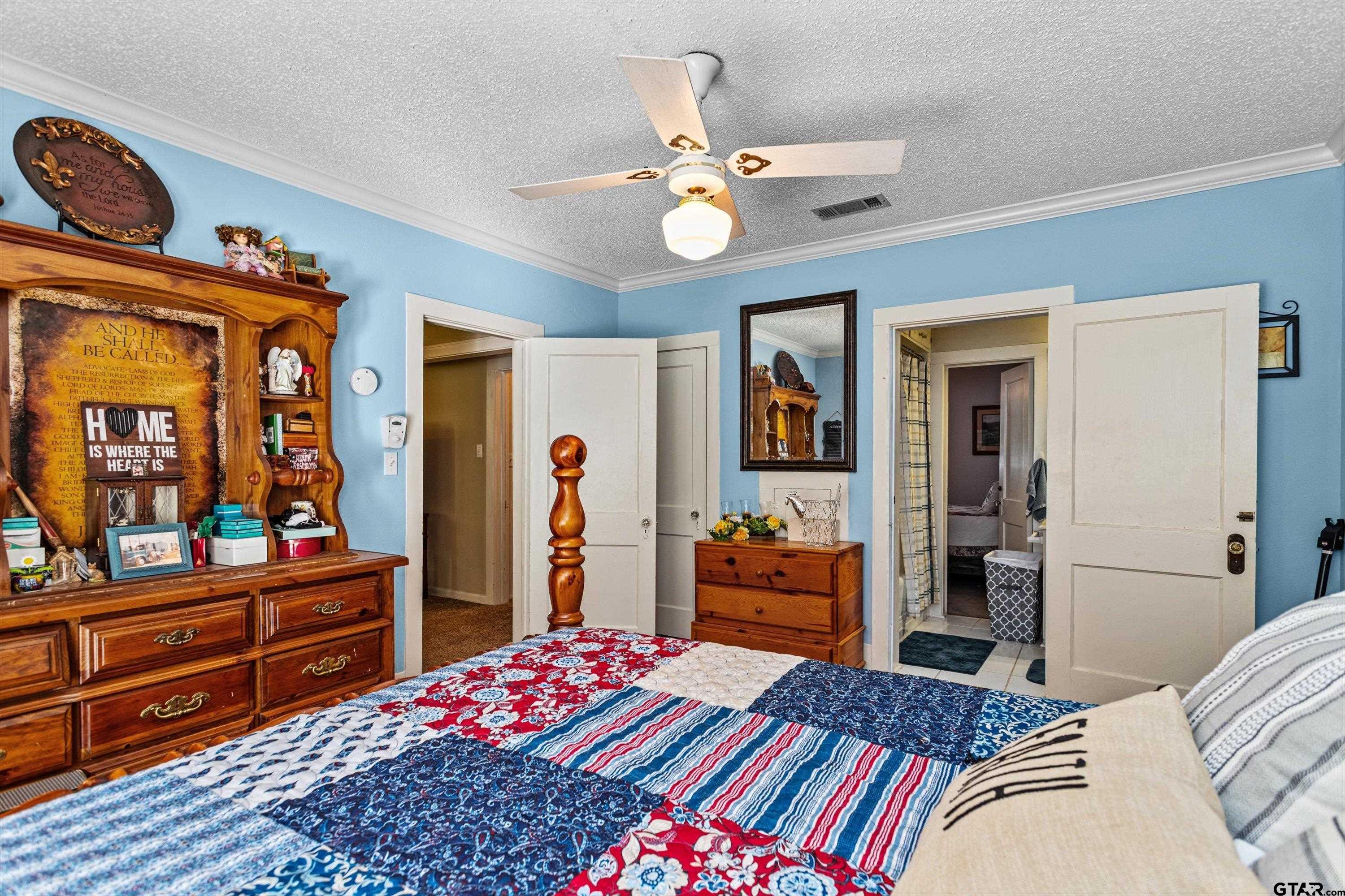 552 Highway 7 Crockett, TX 75835 - Photo 21 of 35 a bedroom with a bed and wooden floor