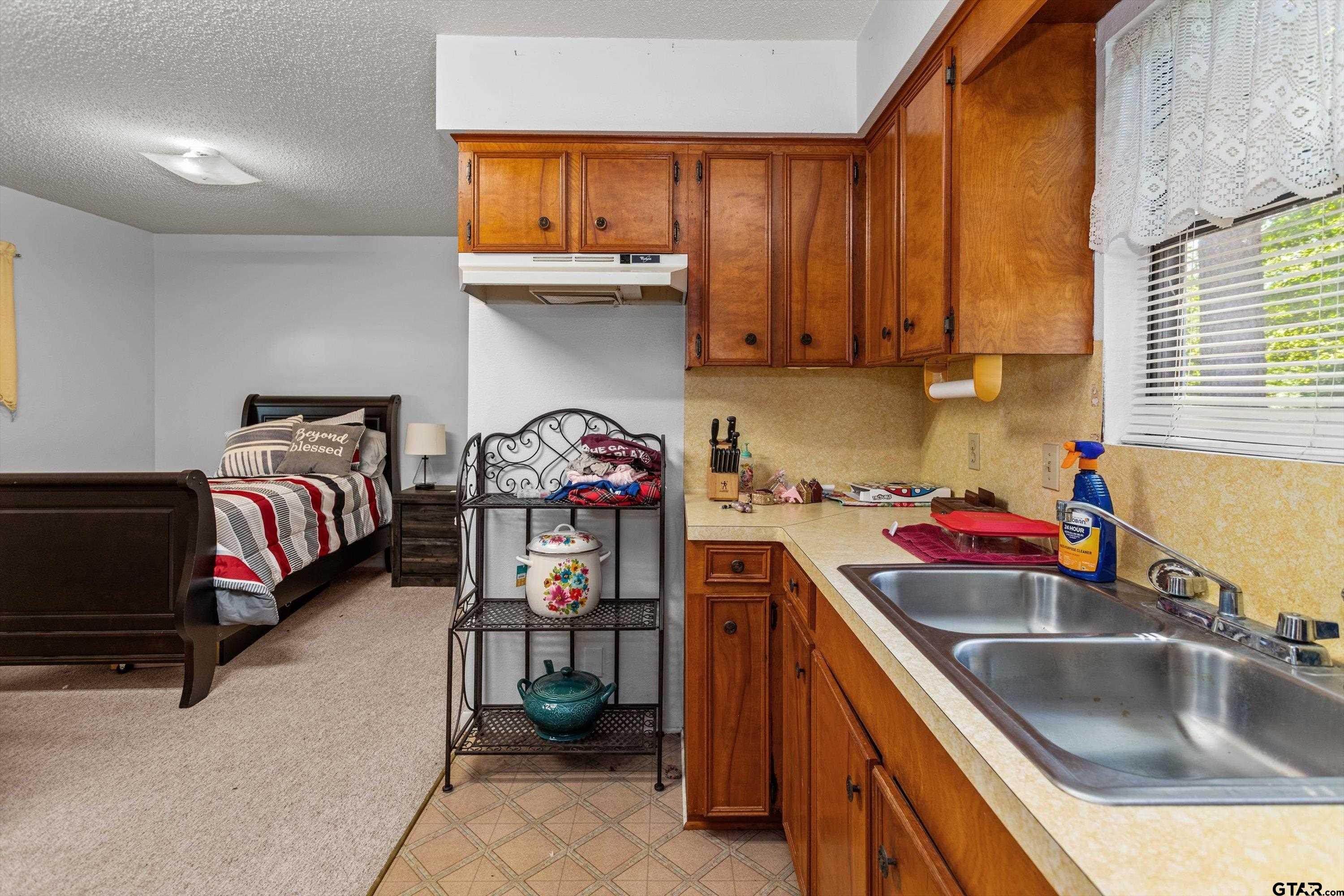 552 Highway 7 Crockett, TX 75835 - Photo 25 of 35 a kitchen with a sink a stove and a cabinets
