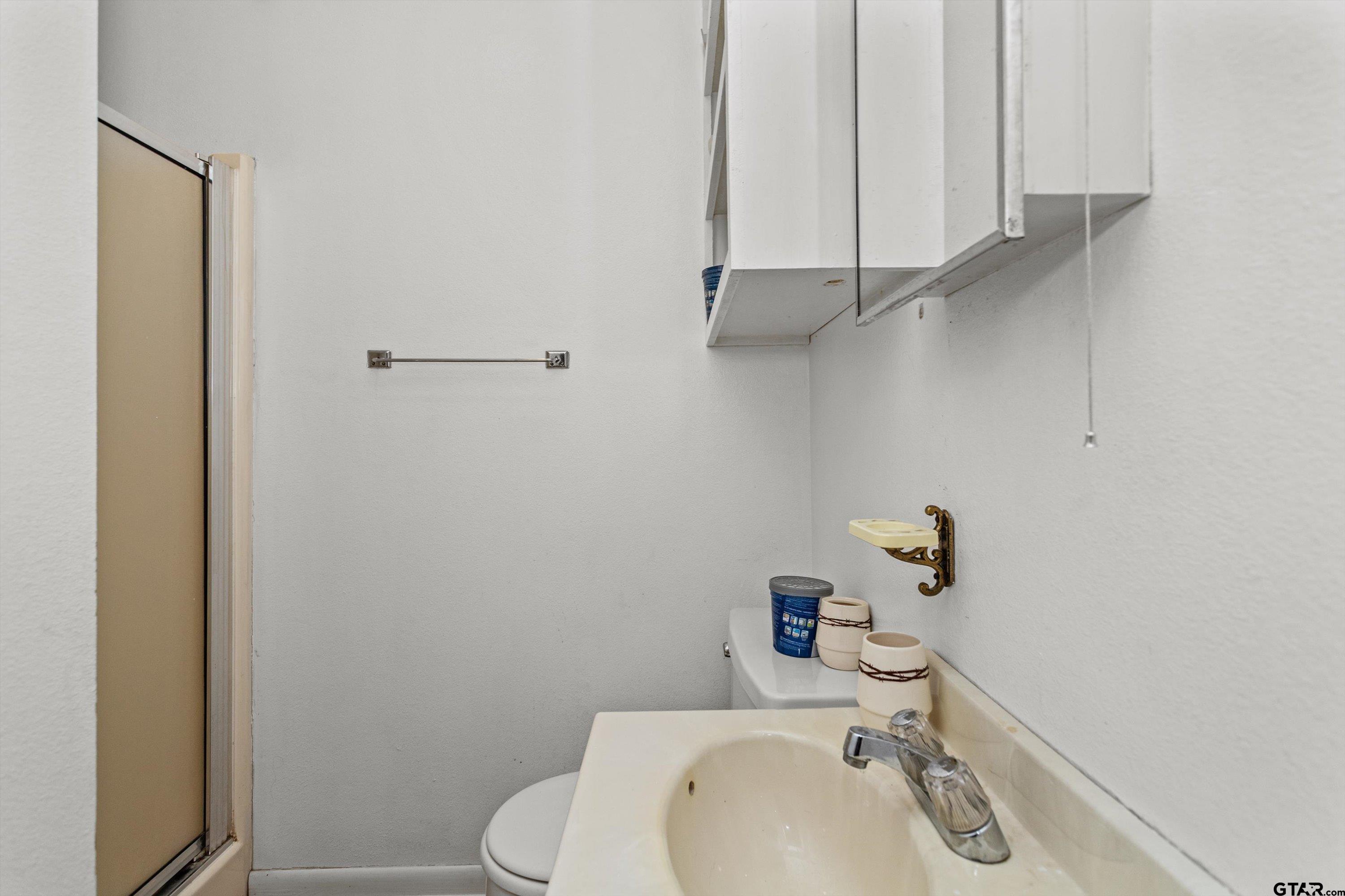 552 Highway 7 Crockett, TX 75835 - Photo 28 of 35 a bathroom with a sink and a toilet