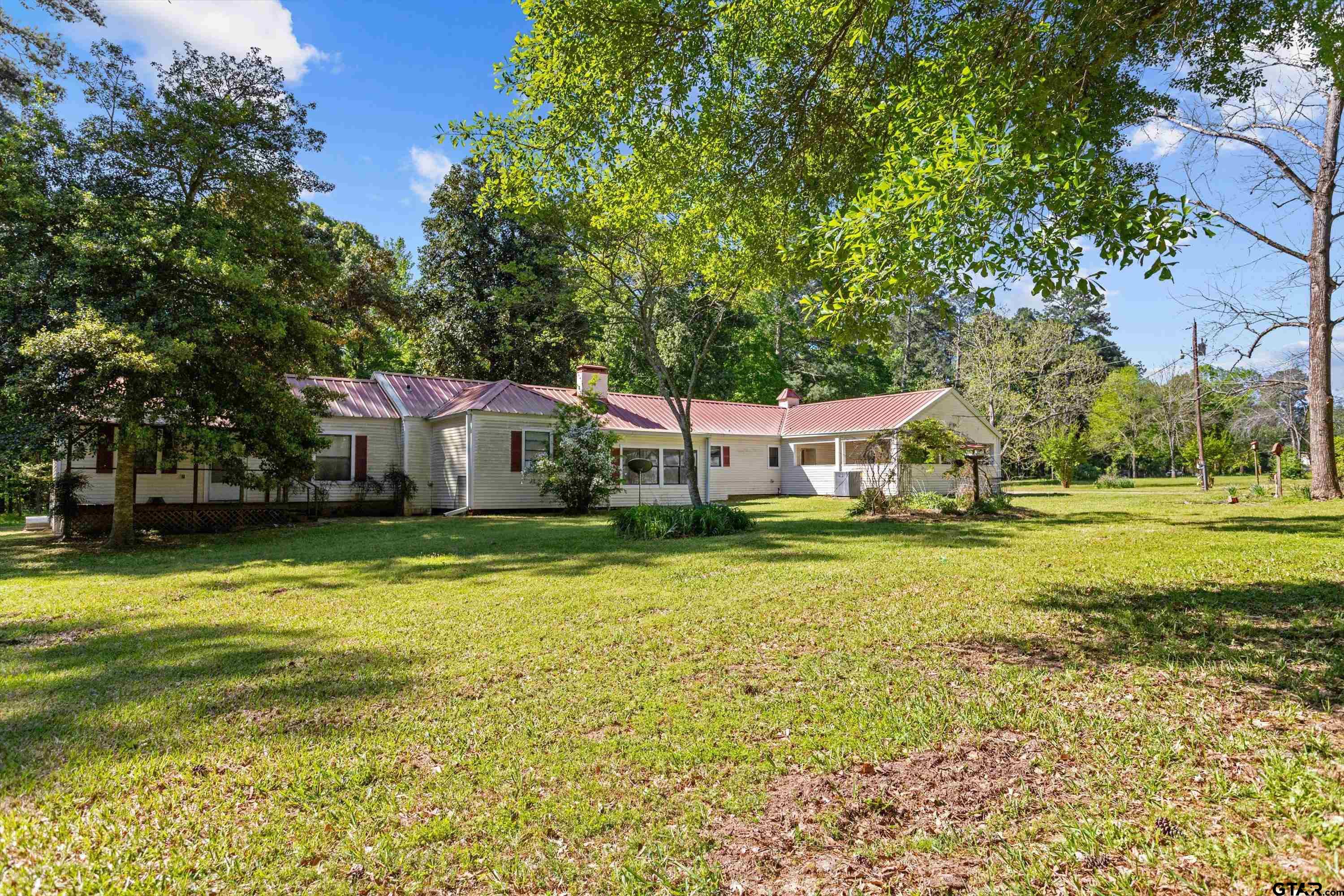 552 Highway 7 Crockett, TX 75835 - Photo 29 of 35 a front view of a house with a big yard