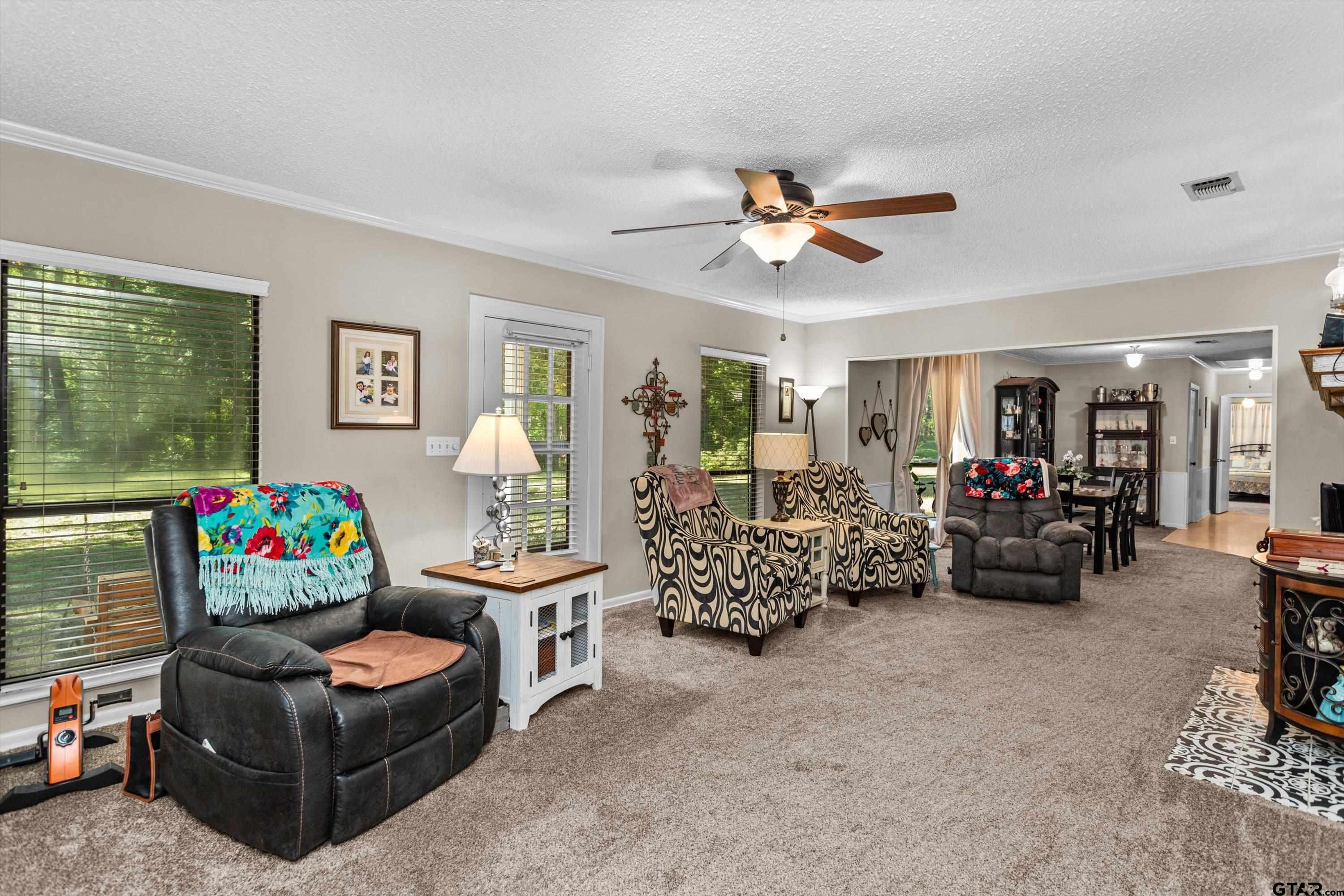 552 Highway 7 Crockett, TX 75835 - Photo 3 of 35 a living room with furniture and a chandelier
