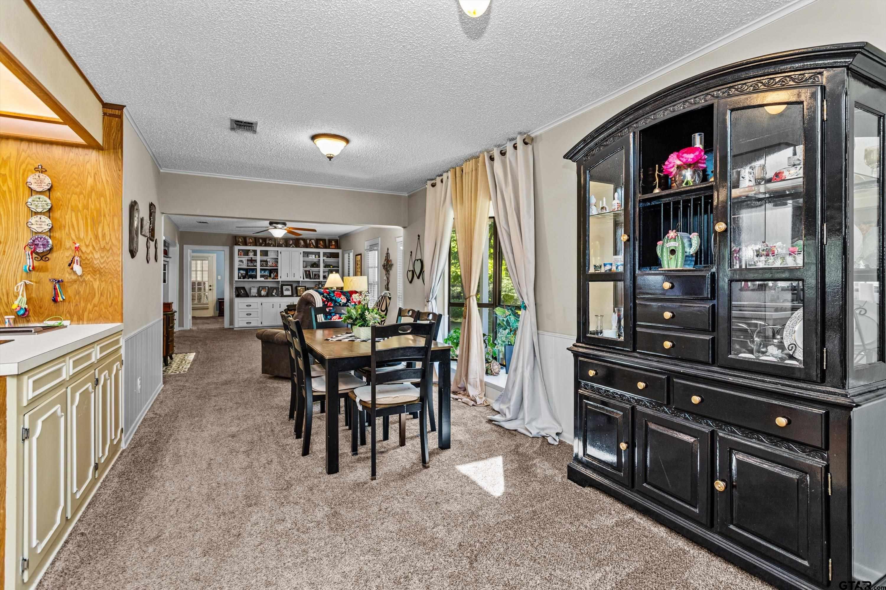 552 Highway 7 Crockett, TX 75835 - Photo 6 of 35 a view of a dining room with furniture wooden floor and chandelier