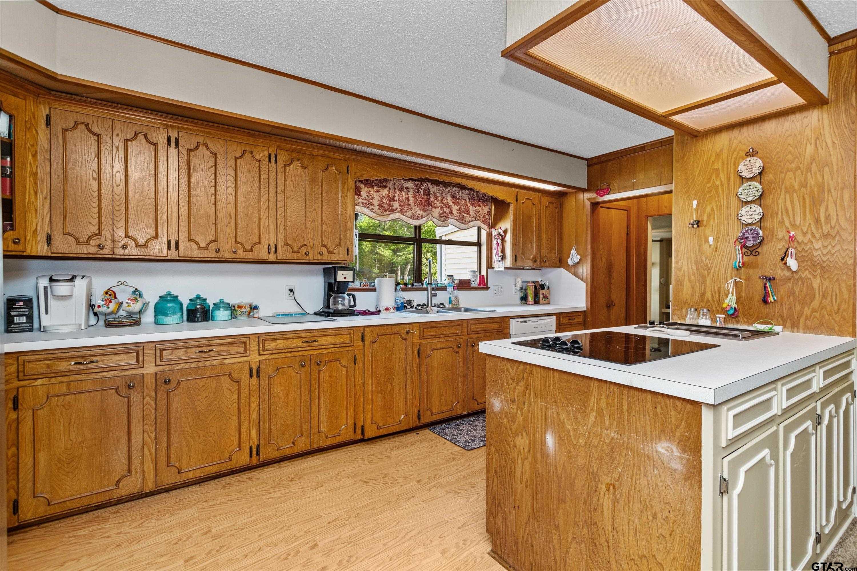 552 Highway 7 Crockett, TX 75835 - Photo 7 of 35 a kitchen with stainless steel appliances granite countertop a sink and a stove