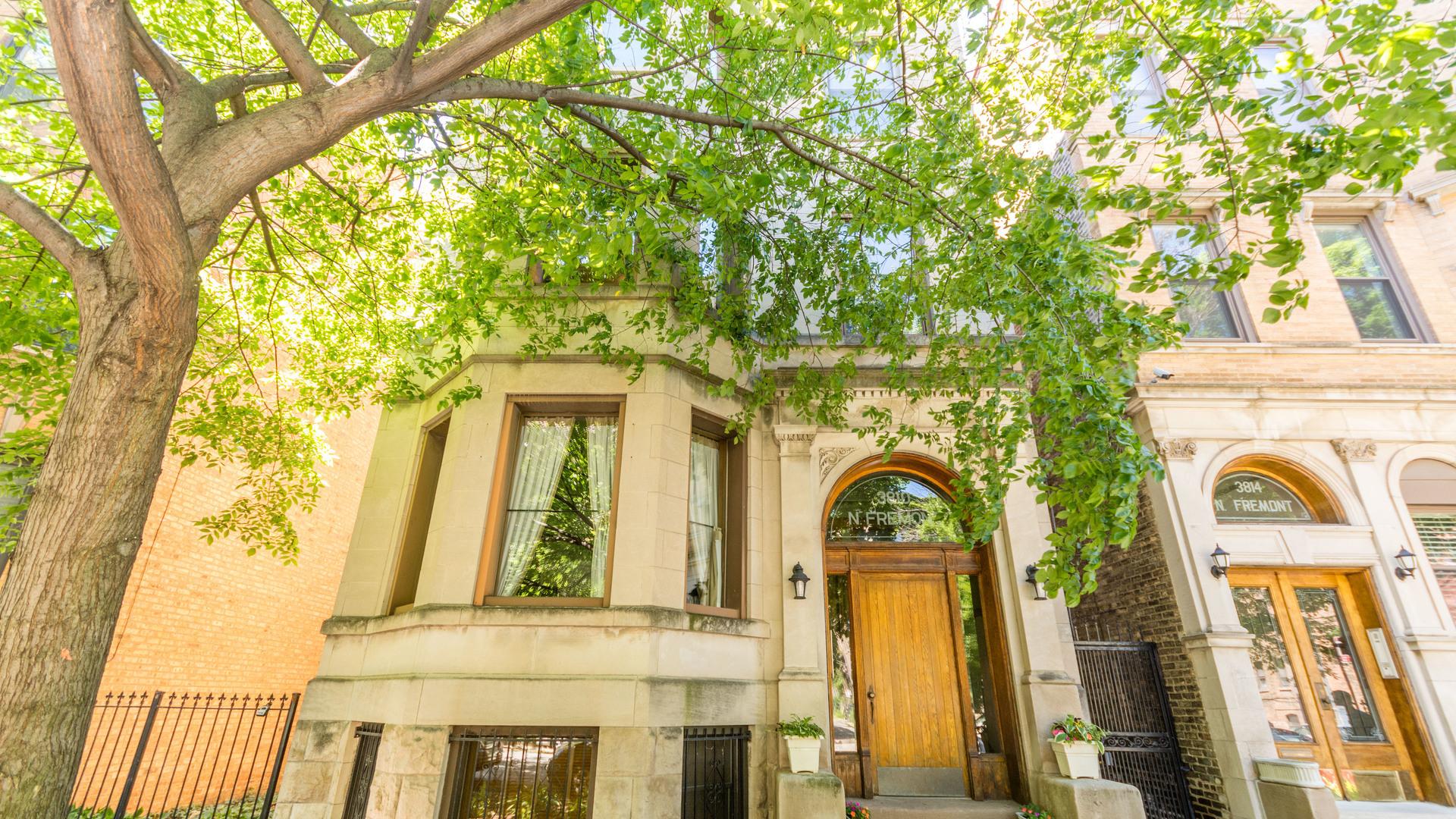 3810 North Fremont Street, Unit 2B Chicago, IL 60613 - Photo 1 of 22 a view of a brick house with large windows