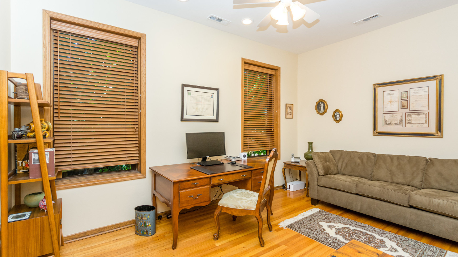3810 North Fremont Street, Unit 2B Chicago, IL 60613 - Photo 16 of 22 a living room with furniture and a flat screen tv