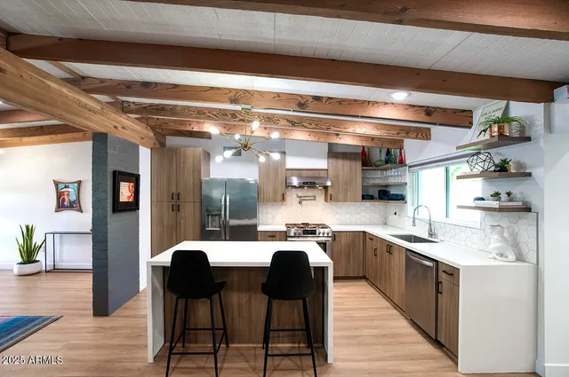 a open kitchen with stainless steel appliances granite countertop a sink and cabinets