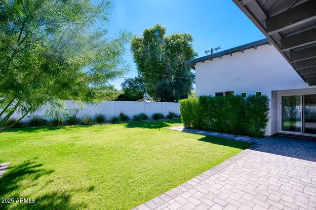 a backyard of a house with lots of green space
