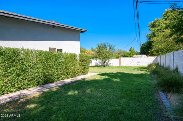 a view of front door and small yard