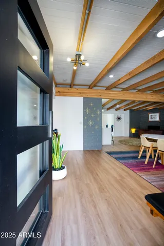 a view of an entryway with wooden floor