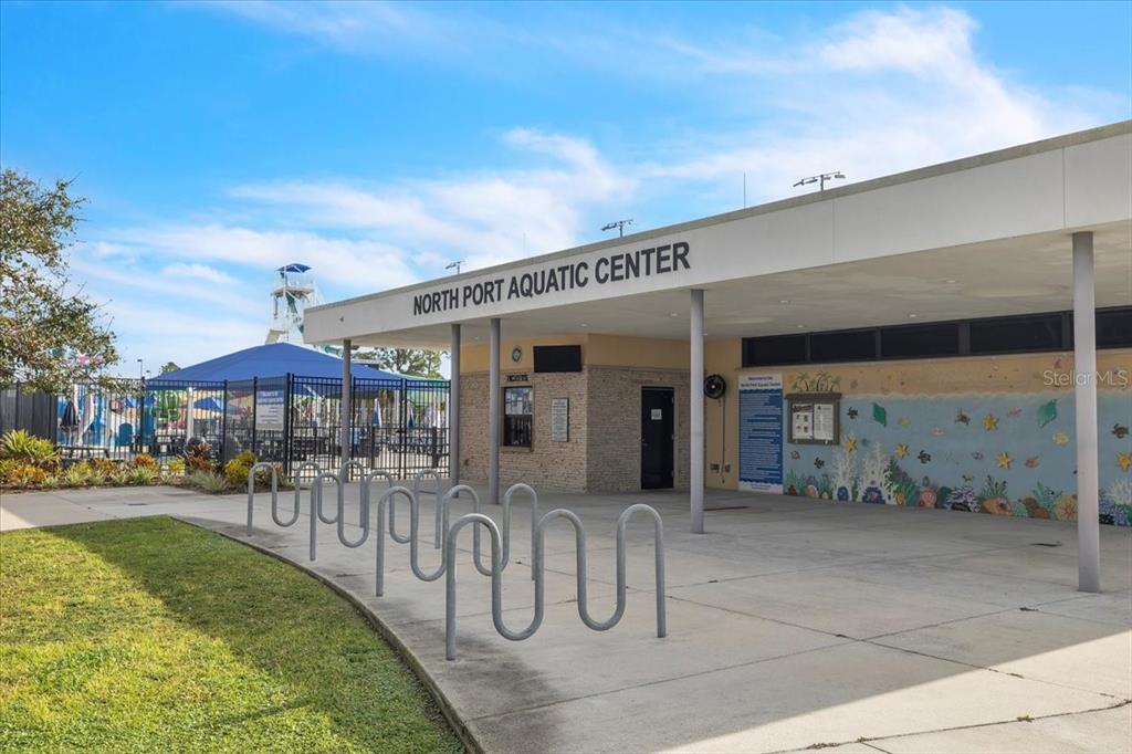 0 Burwin Avenue North Port, FL 34291 - Photo 13 of 19 a front view of a building with dining area and chandelier