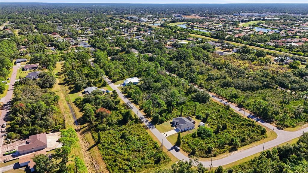 0 Burwin Avenue North Port, FL 34291 - Photo 19 of 19 an aerial view of residential houses with outdoor space and trees