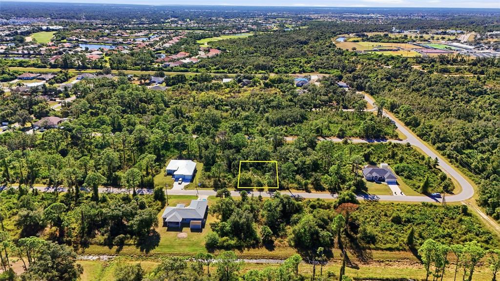 0 Burwin Avenue North Port, FL 34291 - Photo 4 of 19 an aerial view of residential houses with outdoor space and trees