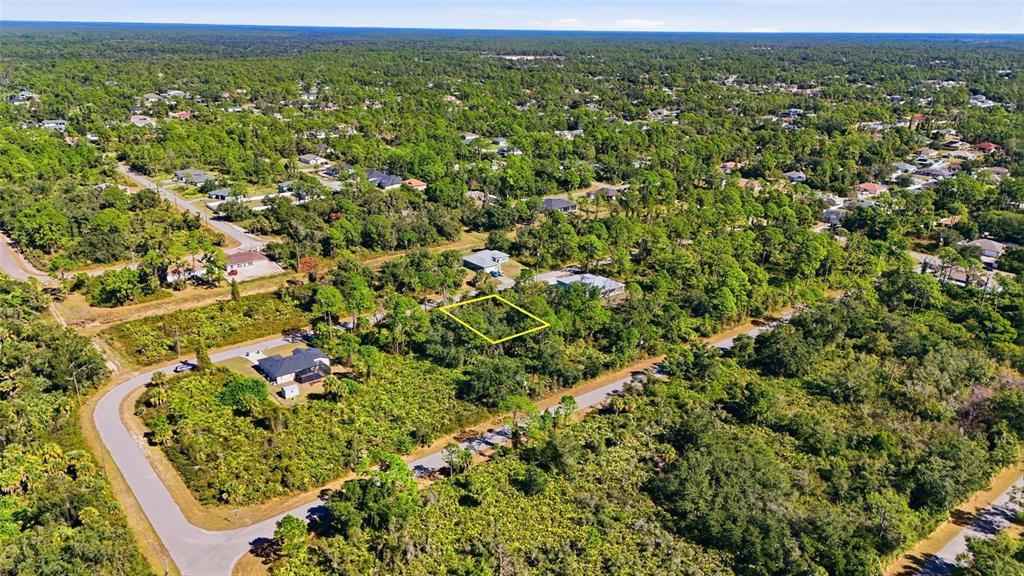 0 Burwin Avenue North Port, FL 34291 - Photo 7 of 19 an aerial view of residential houses with outdoor space and trees